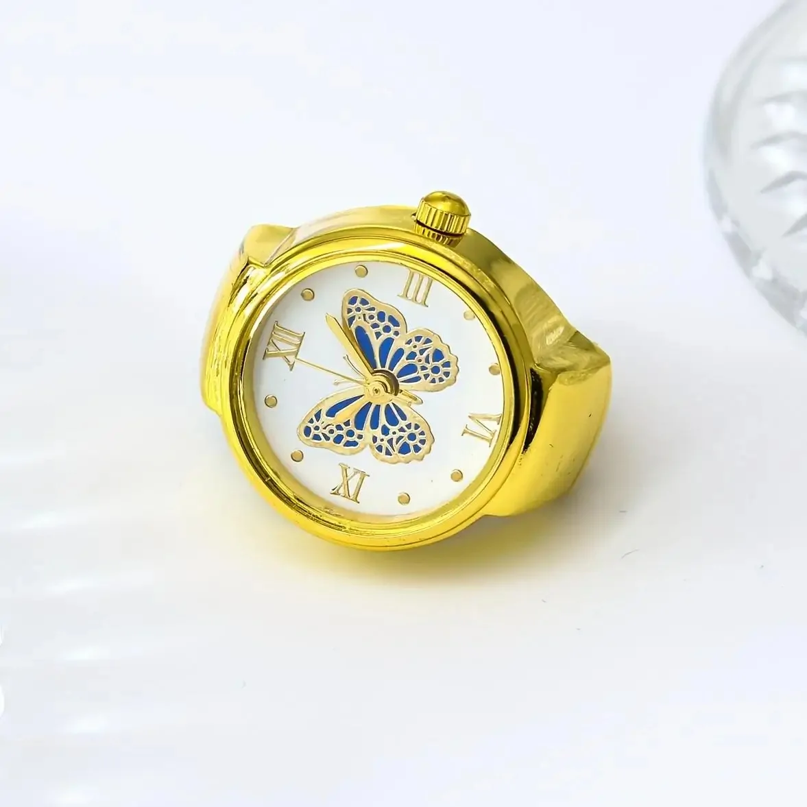 Bague montre papillon, cadran à papillon émaillé, version dore-bleu