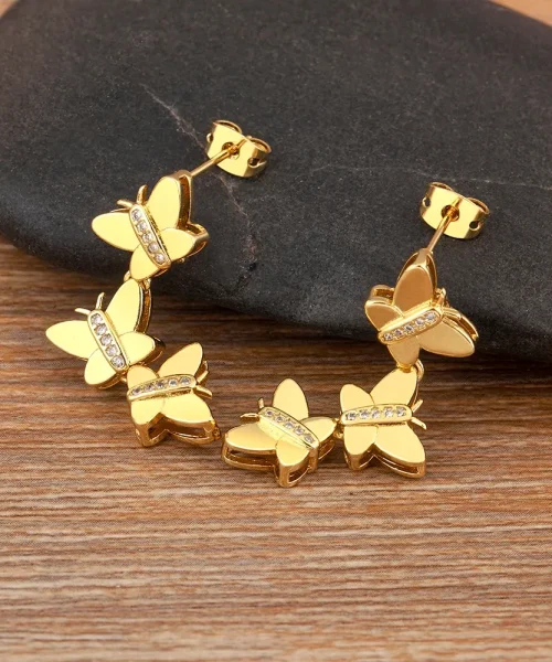 Boucles d'oreilles trois papillons dorés en cascade, corps sertis de zircons