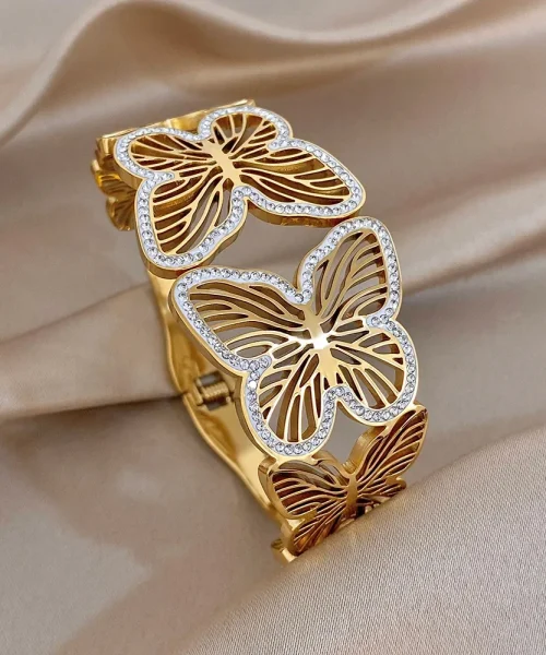 Bracelet papillon ajouré doré en acier inoxydable, papillons évidés bordés de zircons
