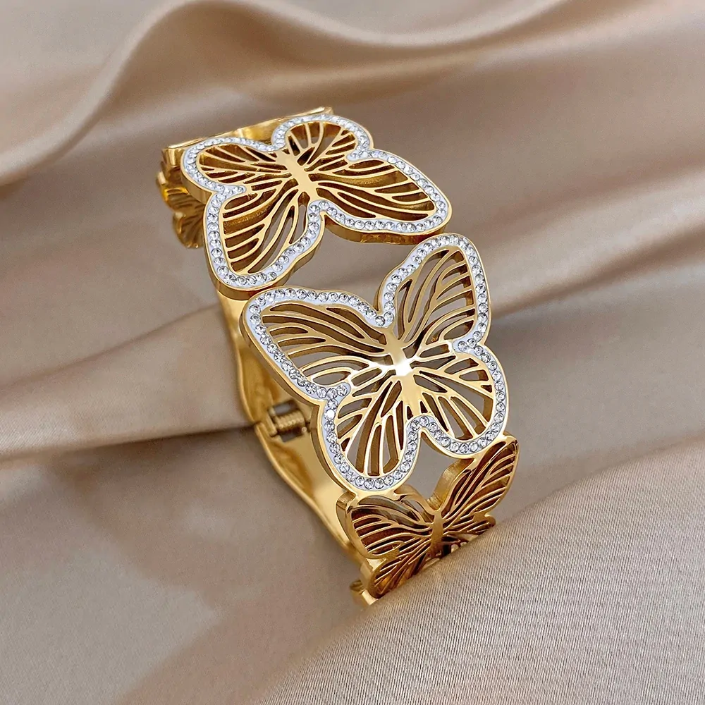 Bracelet papillon ajouré doré en acier inoxydable, papillons évidés bordés de zircons