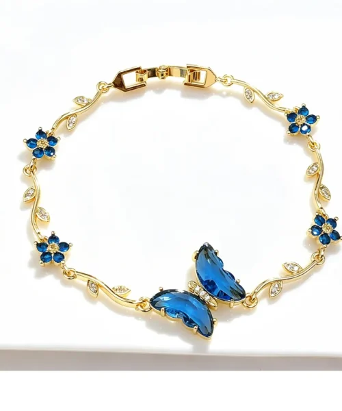 Bracelet papillon cristal bleu, chaîne dorée en branche fleurie