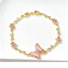Bracelet papillon cristal rose, chaîne dorée en branche fleurie