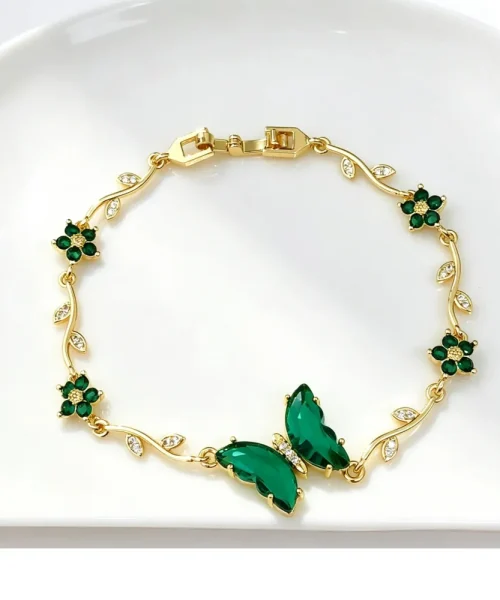 Bracelet papillon cristal vert, chaîne dorée en branche fleurie