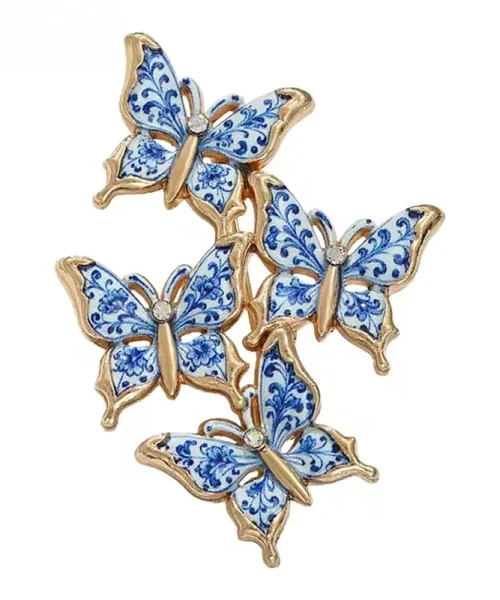 Broche papillon bleu et blanc, quatre papillons en émail façon porcelaine et contour doré