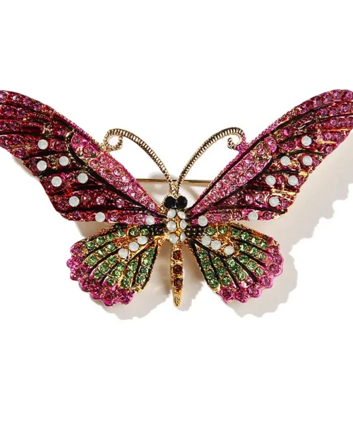 Broche papillon cristal fuchsia, ailes pavées de strass colorés et antennes dorées