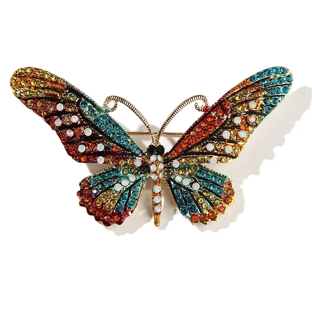 Broche papillon cristal multicolore, ailes pavées de strass colorés et antennes dorées