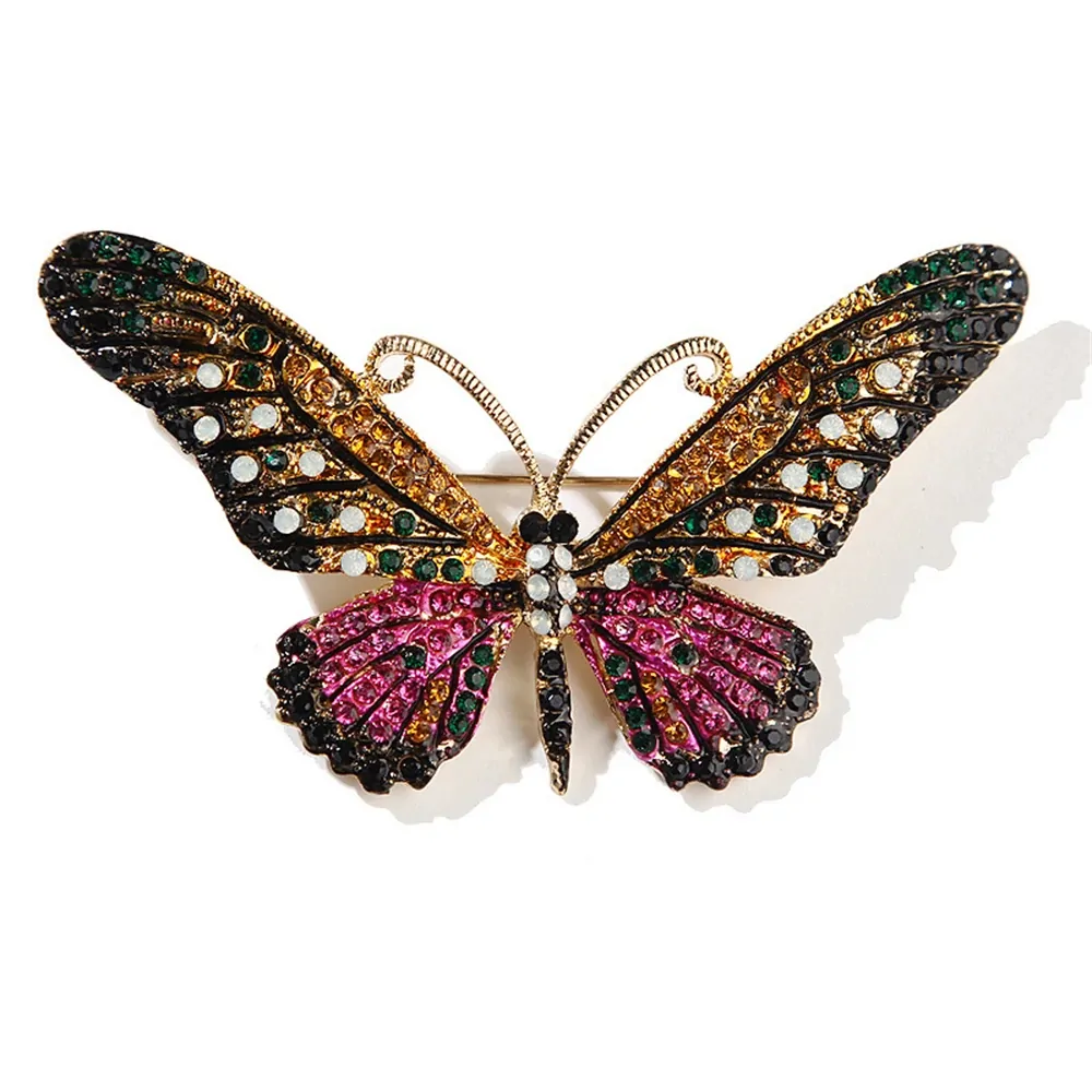 Broche papillon cristal noir et rose, ailes pavées de strass colorés et antennes dorées