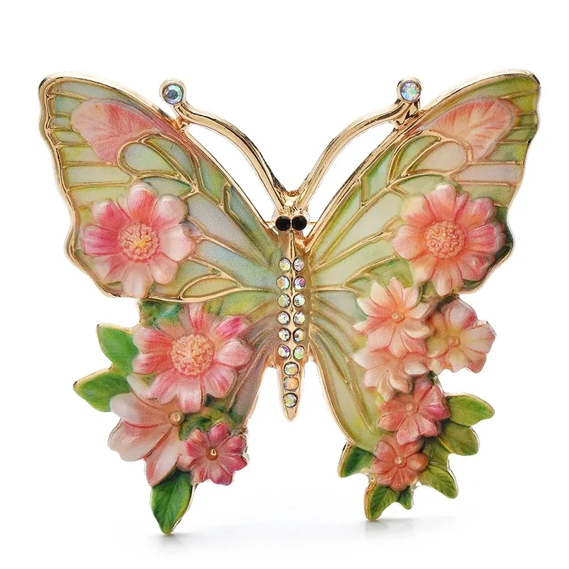 Broche papillon en émail rose, ailes peintes façon vitrail et fleurs en relief