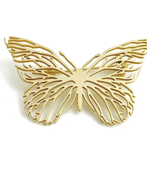 Broche papillon en or aux ailes ajourées de fines nervures dorées