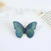 Broche Papillon Irisée bleu, ailes tissées irisées et cristal navette
