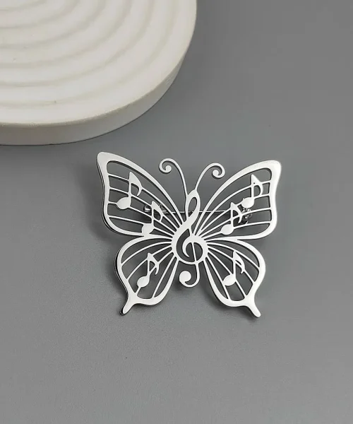 Broche papillon note de musique argentée, clé de sol et notes ajourées en acier inoxydable