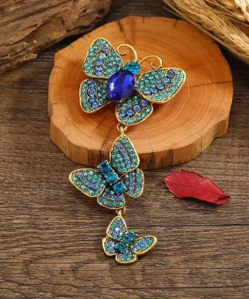 Broche papillon pendante bleu, trois papillons en strass suspendus en cascade