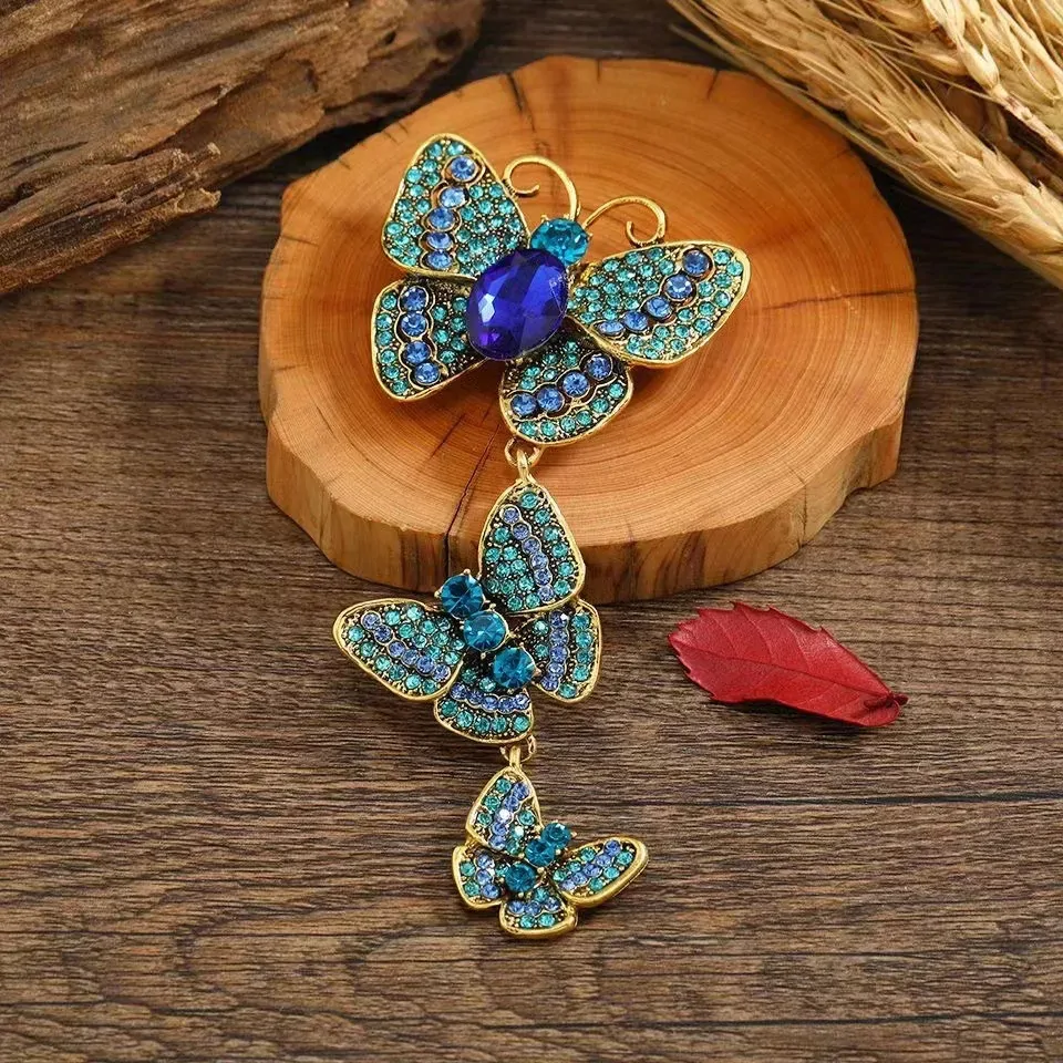 Broche papillon pendante bleu, trois papillons en strass suspendus en cascade