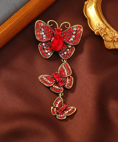 Broche papillon pendante rouge, trois papillons en strass suspendus en cascade