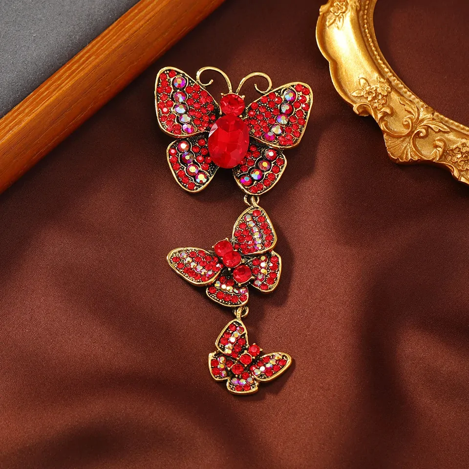 Broche papillon pendante rouge, trois papillons en strass suspendus en cascade