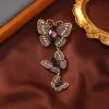 Broche papillon pendante violet, trois papillons en strass suspendus en cascade