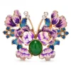 Broche papillon pivoine violette en émail, cabochon vert et antennes perlées