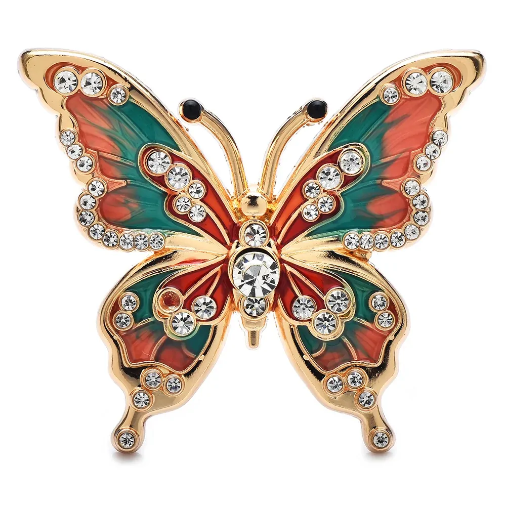 Broche papillon strass vert et corail, ailes en émail bordées de strass et cristal central