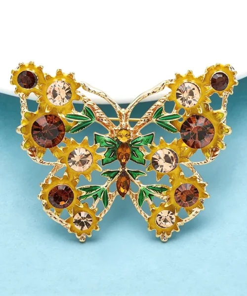 Broche papillon tournesol, détail des feuilles vertes et des pierres navette ambrées