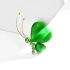 Broche papillon verte, ailes en cœur vert émeraude et antennes dorées