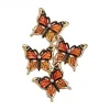 Broche papillons en grappe monarque, quatre papillons en émail et contour doré