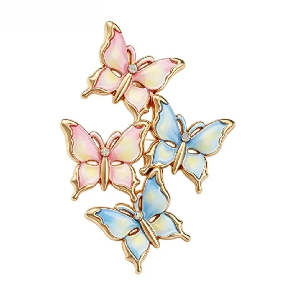 Broche papillons en grappe rose et bleu, quatre papillons en émail et contour doré