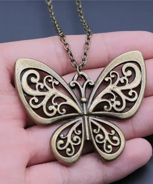 Collier papillon argent antique, grand pendentif métal vieilli ajouré, modèle volutes-bronze