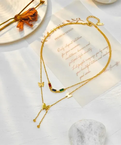 Collier papillon double rang doré en acier inoxydable, zircons colorés et pampille papillon