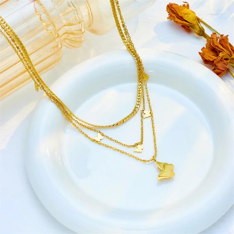 Collier papillon multirang doré en acier inoxydable, trois rangs superposés à papillons