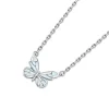 Collier papillon phosphorescent argenté, pendentif papillon bleu glacier qui brille dans le noir