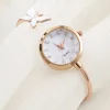 Montre jonc papillon femme finition or rose, cadran nacré et papillon blanc