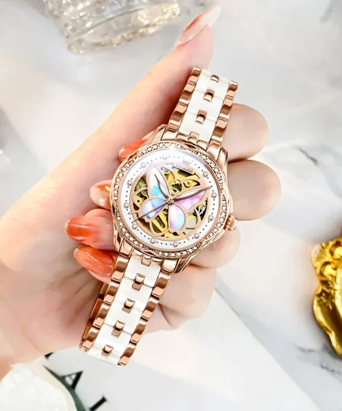 Montre papillon automatique femme, cadran squelette à papillon nacré et bracelet or rose et céramique