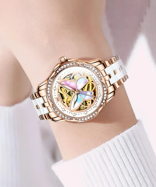 Montre papillon automatique femme, cadran squelette à papillon nacré et bracelet or rose et céramique