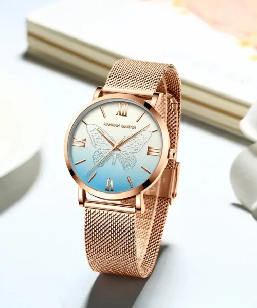 Montre papillon or rose femme, maille milanaise acier et cadran bleu à papillon gravé