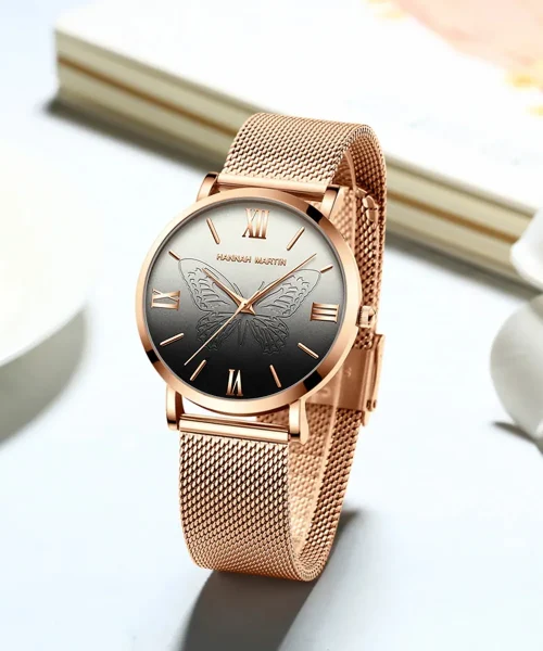 Montre papillon or rose femme, maille milanaise acier et cadran noir à papillon gravé