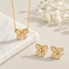 Parure papillon zircon doré, collier et boucles d oreilles papillon pavé de zircons