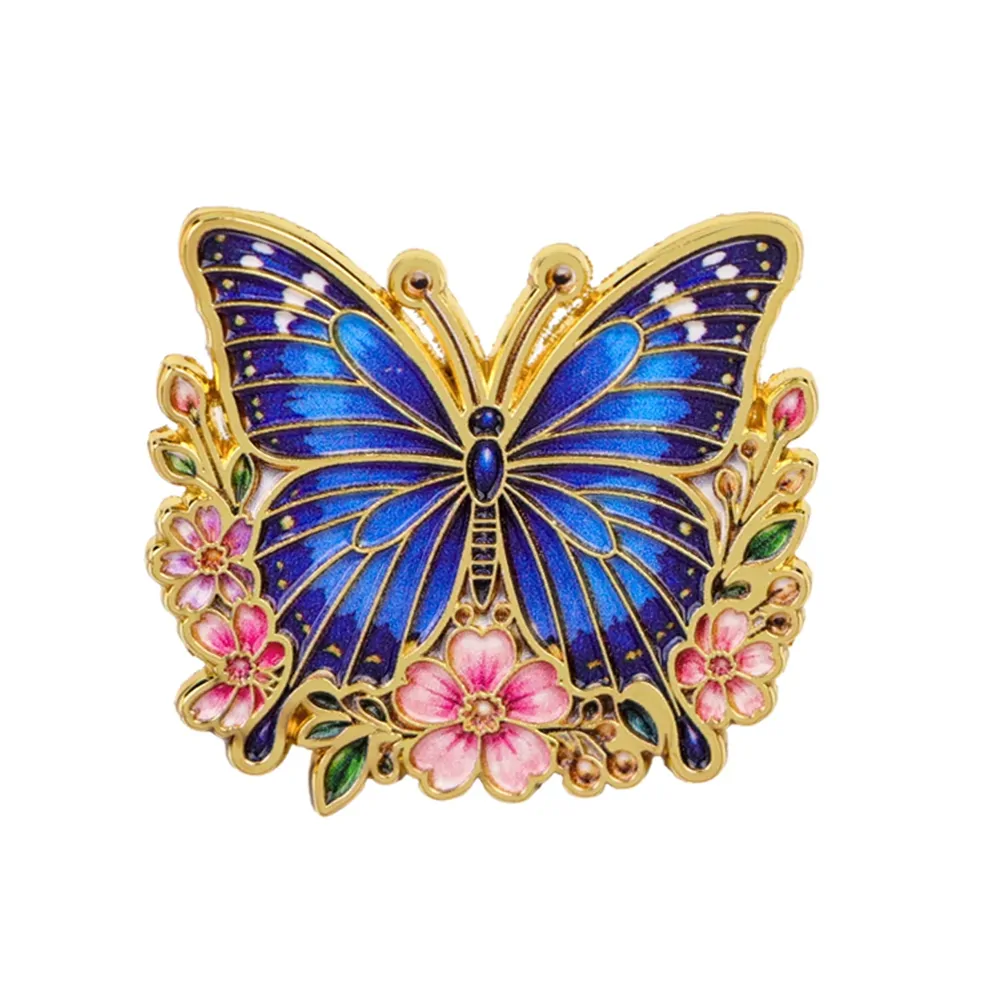 Pin's papillon fleuri bleu nuit, papillon en émail sur couronne de fleurs dorée