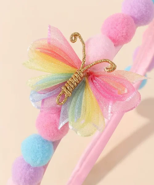 Serre-tête papillon arc-en-ciel, détail du papillon en ruban d'organza et cordon doré