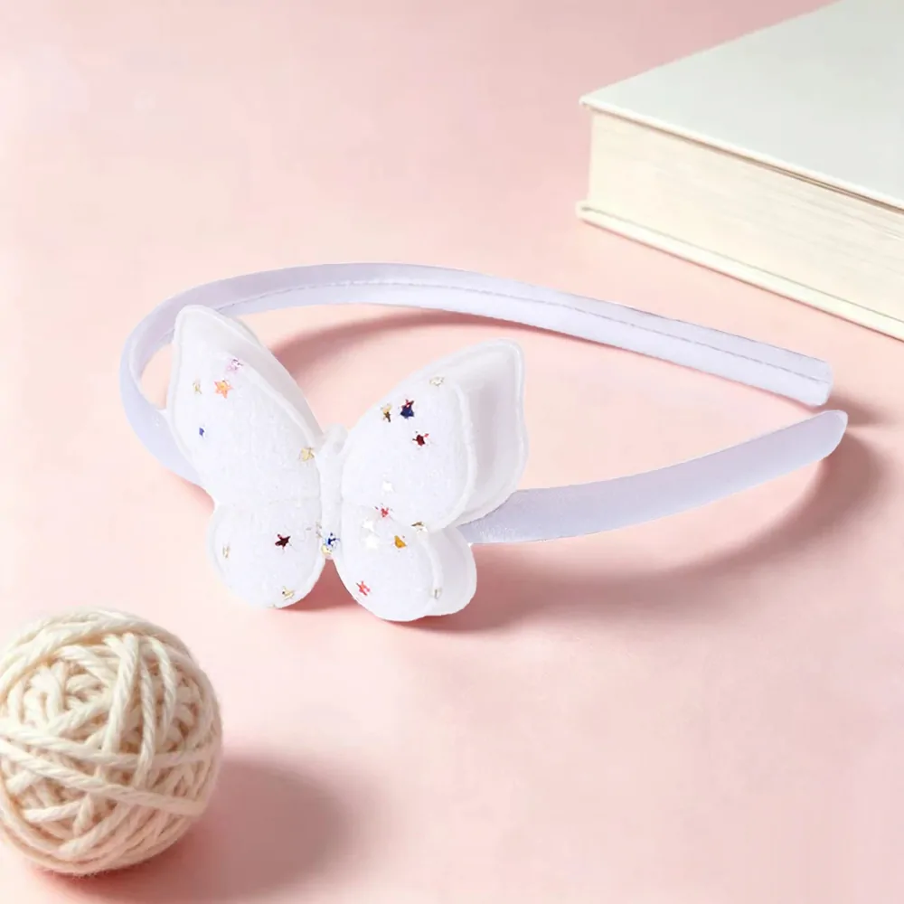 Serre-tête papillon pailleté blanc, arceau satiné et papillon à paillettes semé d'étoiles