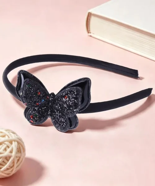 Serre-tête papillon pailleté noir, arceau satiné et papillon à paillettes semé d'étoiles