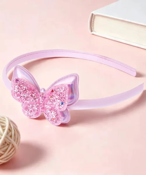 Serre-tête papillon pailleté rose, arceau satiné et papillon à paillettes semé d'étoiles
