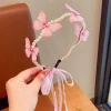 Serre-tête papillon perles et ruban rose, arceau ondulé perlé, papillons en voile et nœud d'organza