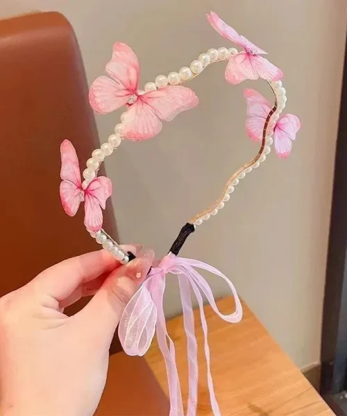 Serre-tête papillon perles et ruban rose, arceau ondulé perlé, papillons en voile et nœud d'organza