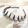 Serre-tête papillon strass argenté, arceau ondulé à dents noir couronné de papillons pavés