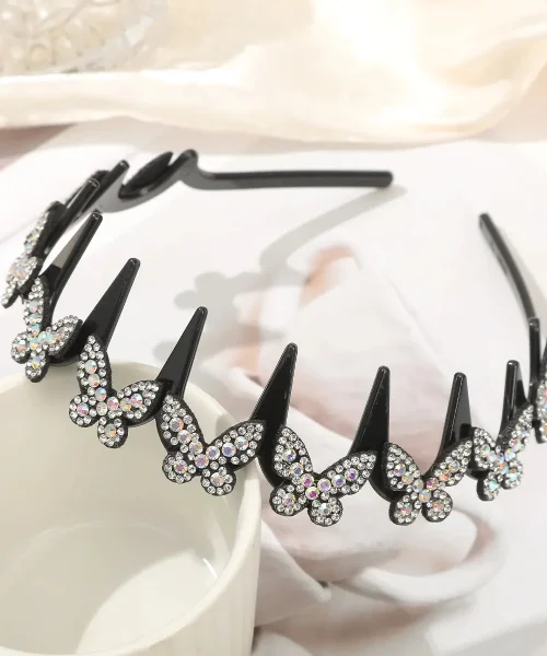 Serre-tête papillon strass argenté, arceau ondulé à dents noir couronné de papillons pavés