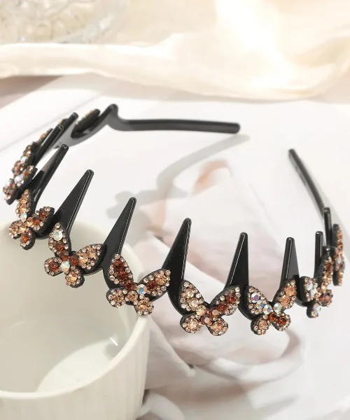 Serre-tête papillon strass champagne, arceau ondulé à dents noir couronné de papillons pavés